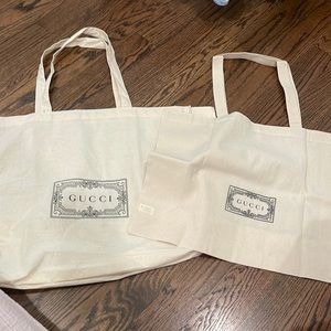 2 large Gucci shopping bags